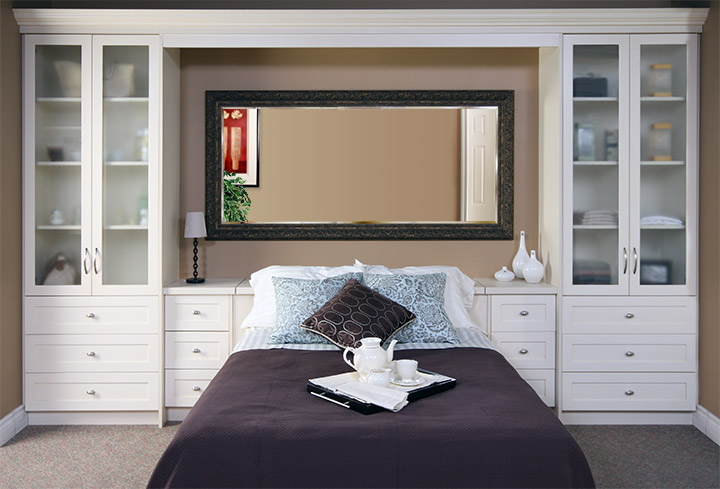 bedroom furniture that surrounds the bed