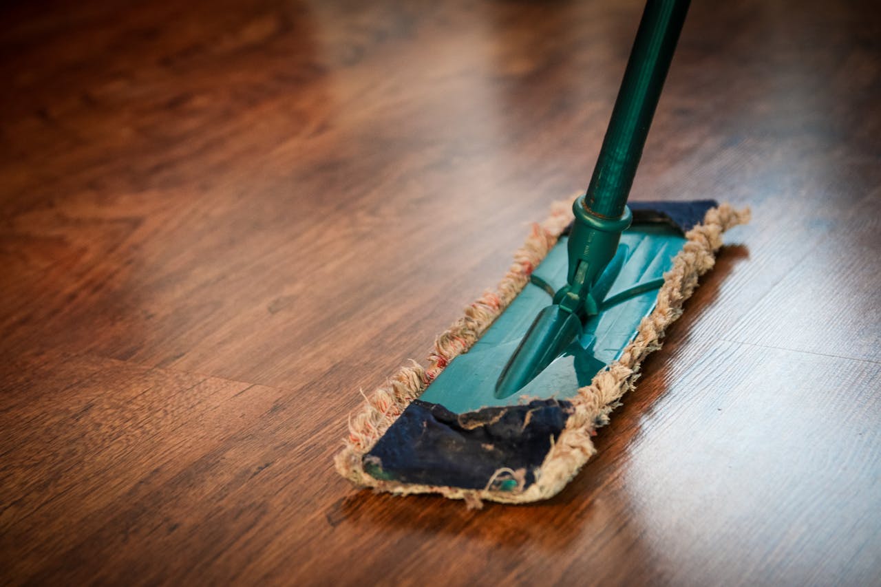 wood floor being mopped while spring cleaning