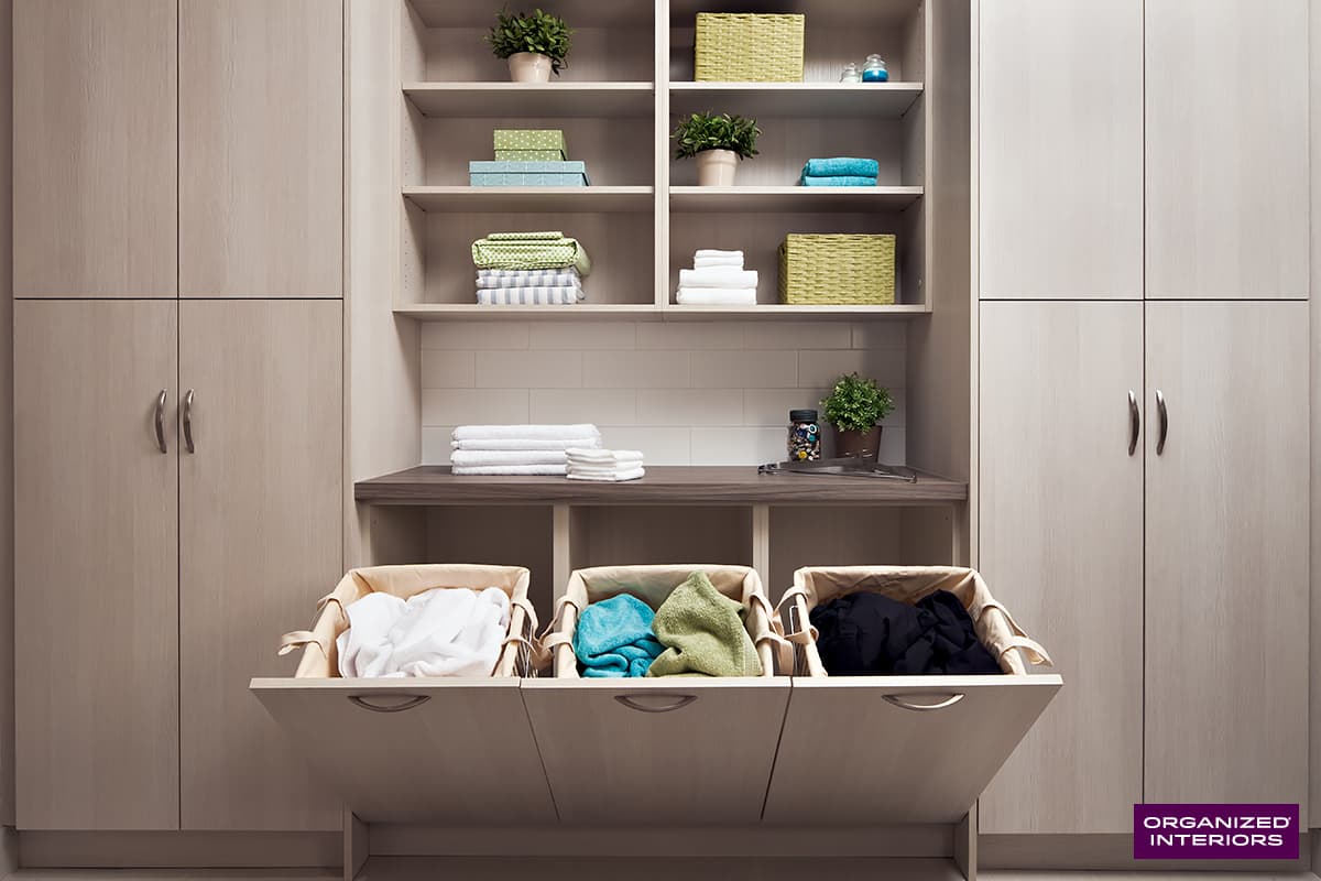 laundry room open shelving with laundry hampers