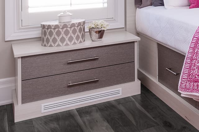 A heat deflector built into a custom side table