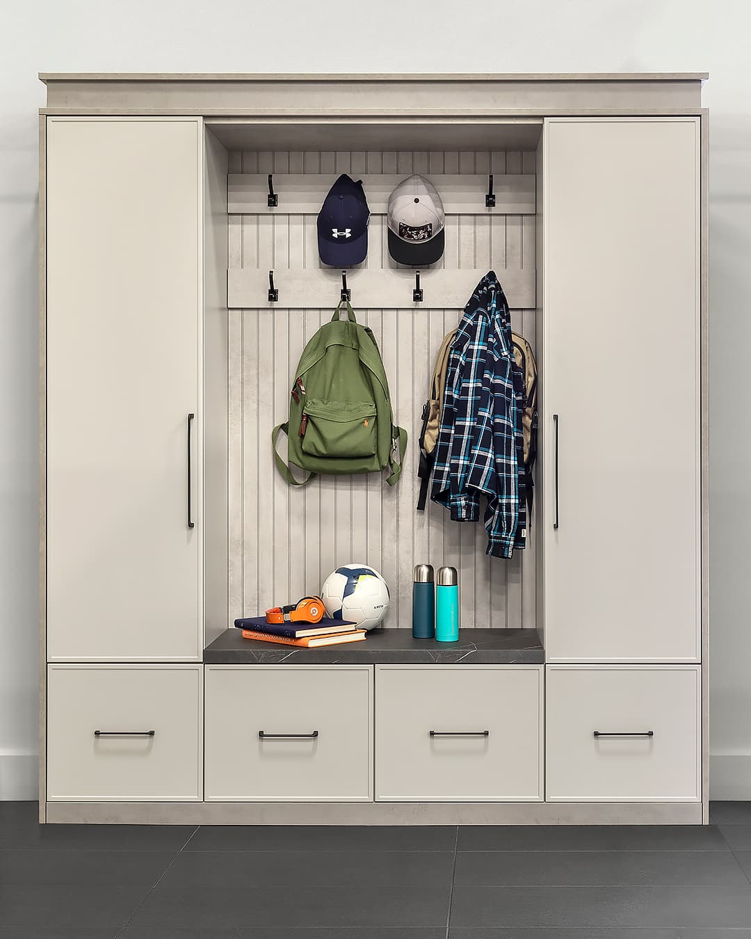 beige mudroom with kids clothing